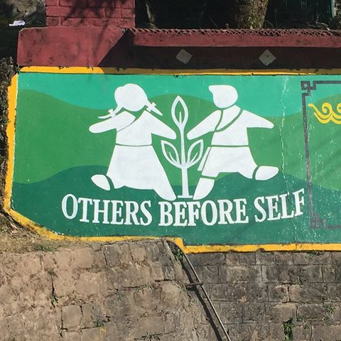 TCV school sign, Dharmsala: Others Before Self